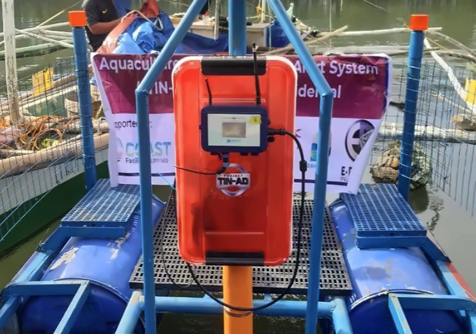 HydroNeo Mini Controller in an orange protective housing on a floating research platform in the Philippines