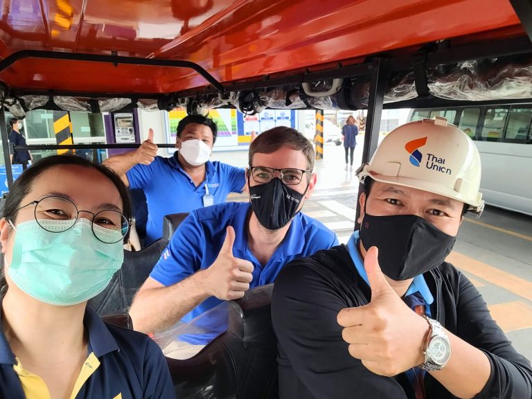 HydroNeo CEO and Founder Fabian Reusch, and Customer Success Manager and Co-Founder Thanongsak Chongsiri with the team wearing masks and safety gear while in a vehicle at the Thai Union