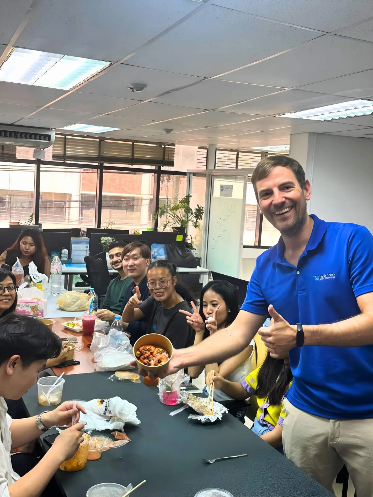 HydroNeo CEO and Founder Fabian Reusch together with the team enjoying shrimp during a Friday lunch together