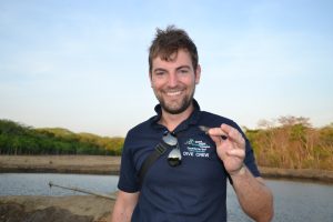 HydroNeo Founder and CEO Fabian Reusch smiling while holding a shrimp in 2012