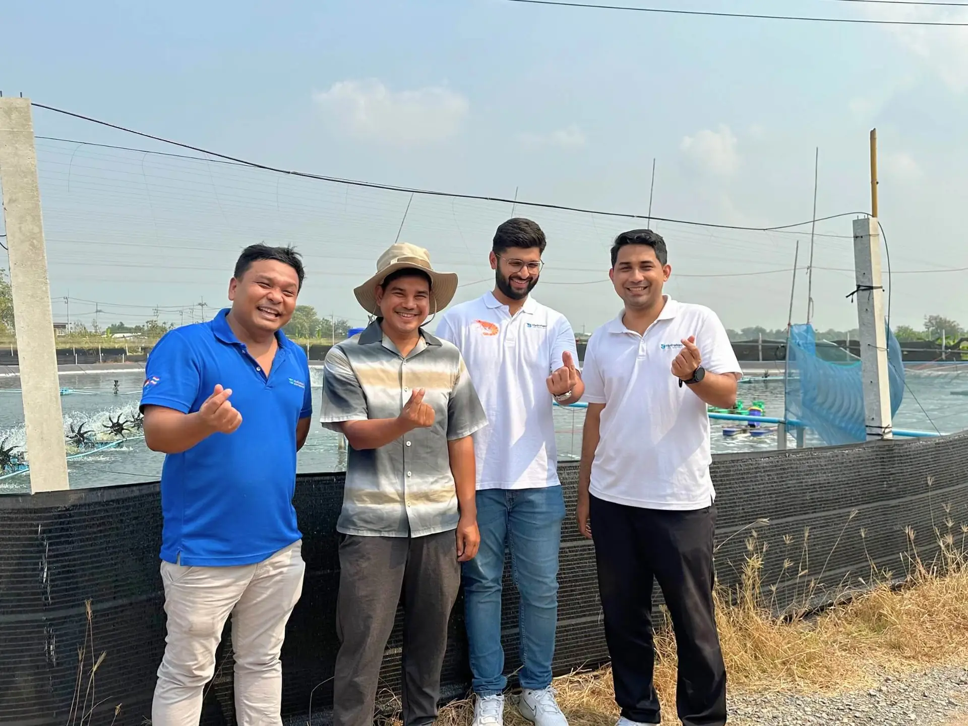 HydroNeo Team doing a photoshoot with a smarter farmer during a shrimp farm visit in Thailand