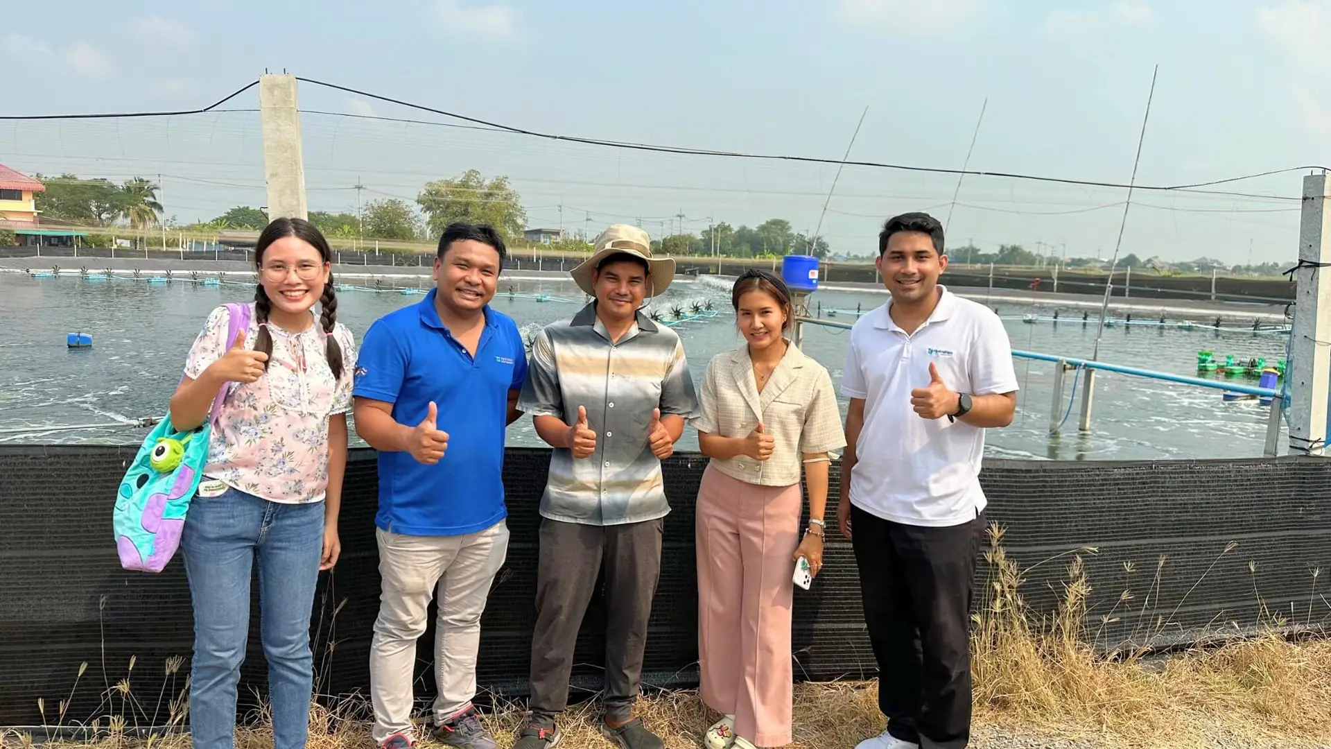 HydroNeo Team doing a photoshoot with smarter farmers during a shrimp farm visit in Thailand