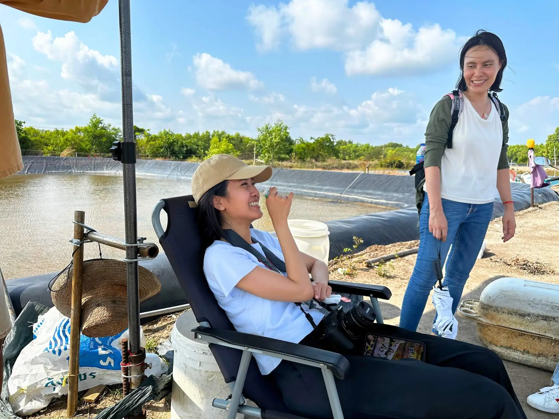 HydroNeo team laughing together during a visit to an aquaculture farm in Thailand